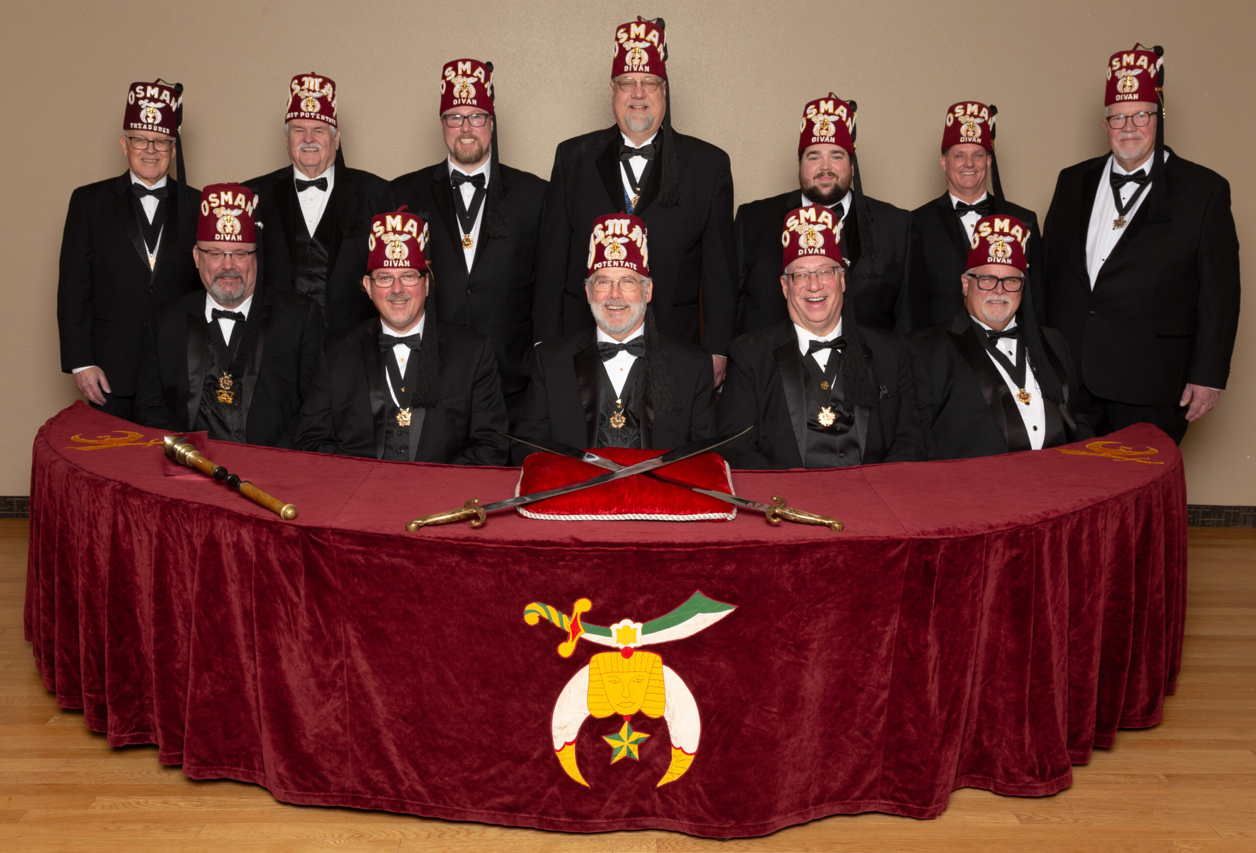 Osman Shrine divan sitting at shriners table.
