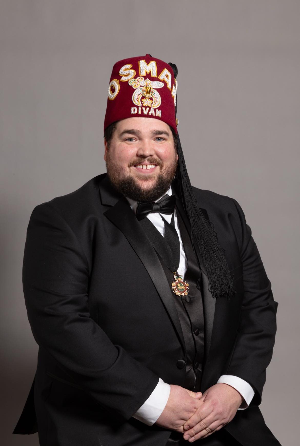 Jason Kennedy portrait against a grey background